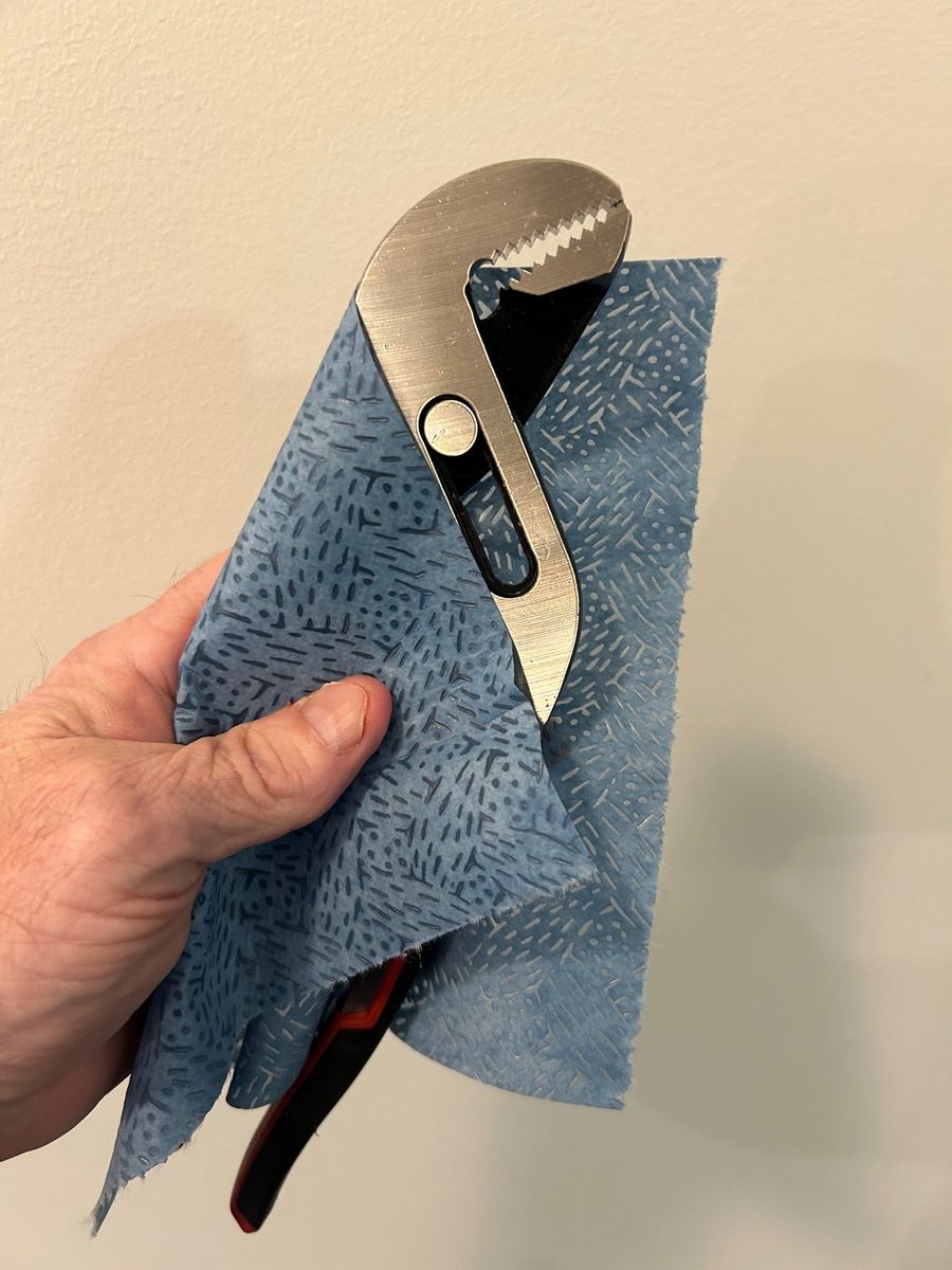 Brute Strength Wipes cleaning a wrench for mechanic-shop cleanup